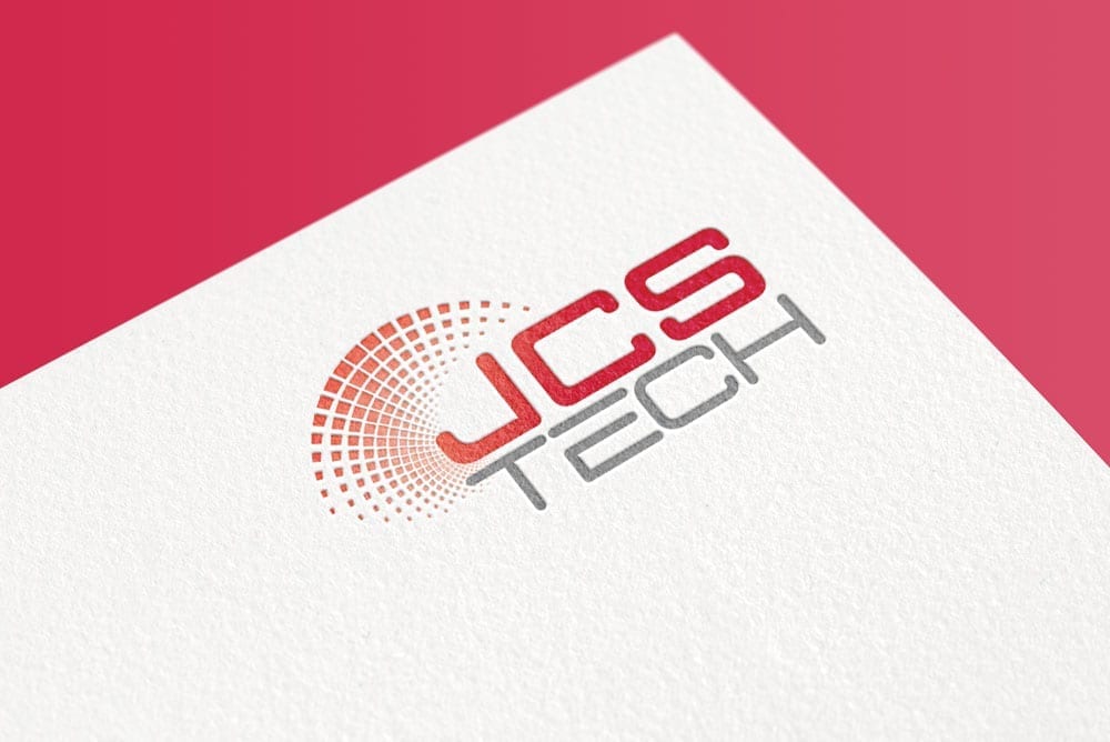 Logo of JCS Tech featuring the company name in red and grey colors with a semi-circle dotted design next to it, set against a textured white background with a red gradient.