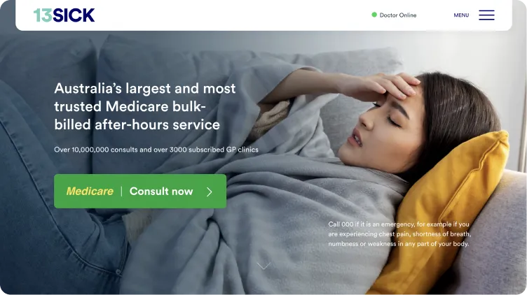 A woman is lying on a couch with a blanket on her head.