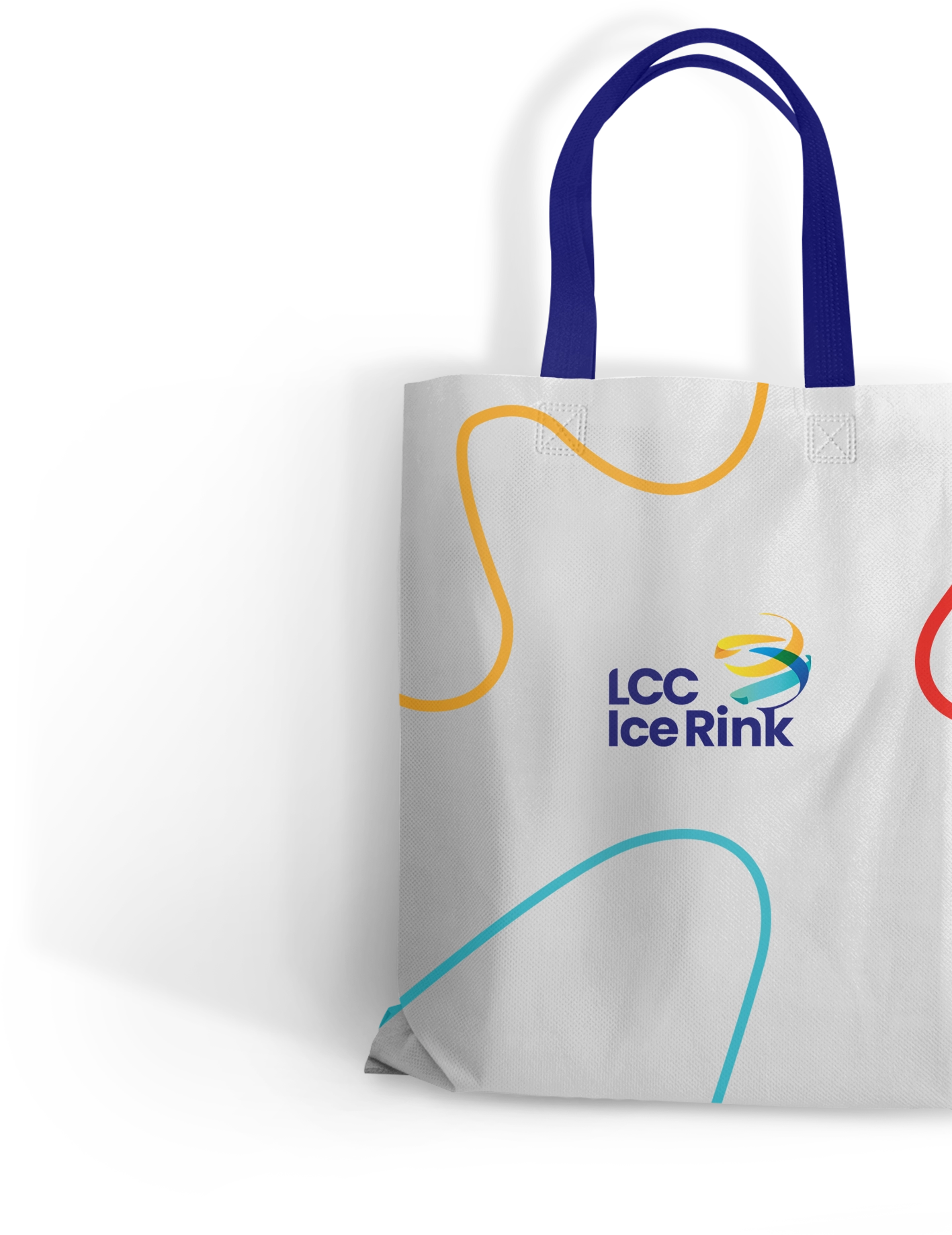 A white tote bag with blue handles features a colorful wavy line design and the LCC Ice Rink logo prominently displayed in the center.