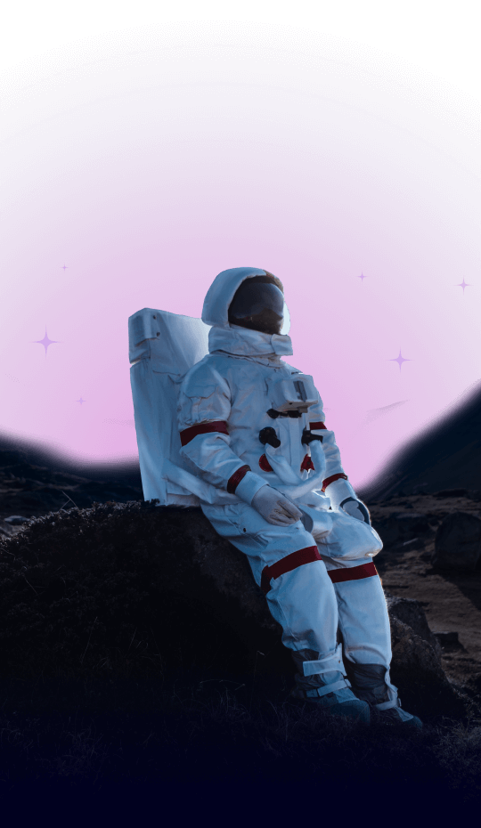 An astronaut in a white spacesuit sits on a rock at night, with a vibrant purple and pink sky glowing brilliantly in the background, evoking a sense of home beyond Earth.