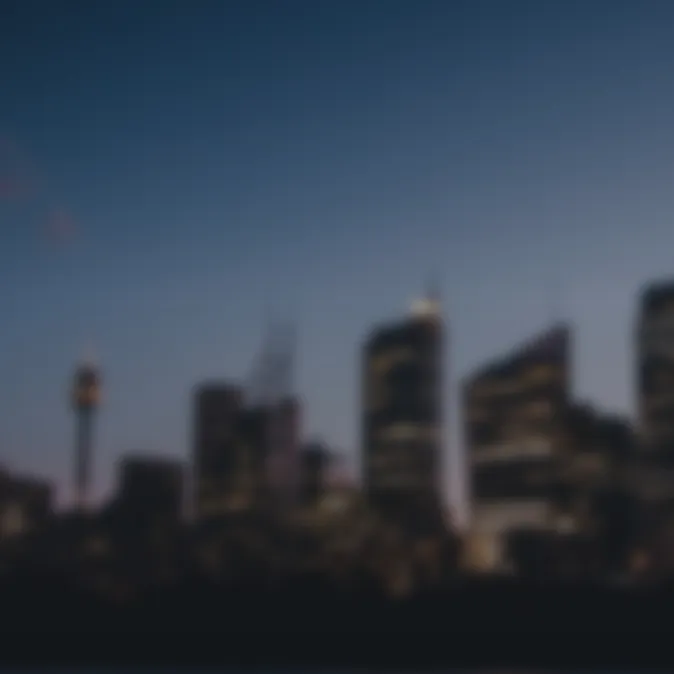 Blurry image of a city skyline at dusk, with various buildings and structures silhouetted against the evening sky.
